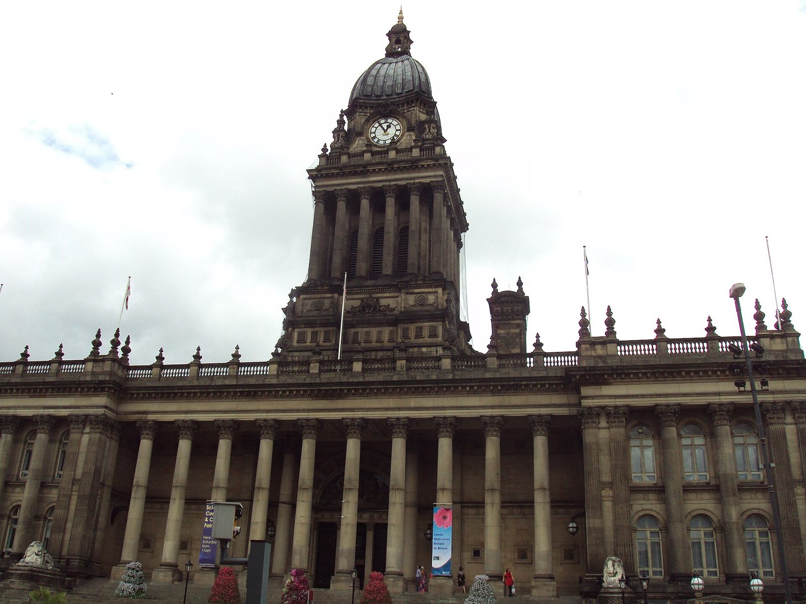 imposing neoclassical Leeds Town Hall clock tower along The Headrow viewed in daylight conditions